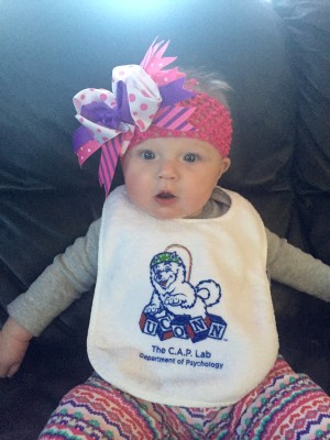 Baby wearing CAP lab bib